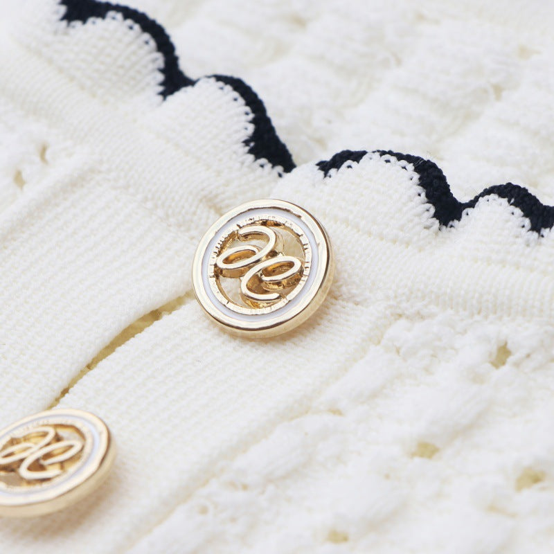 High-quality, elegant knit dress with a round neckline, short sleeves, lace details, and mid-length hem