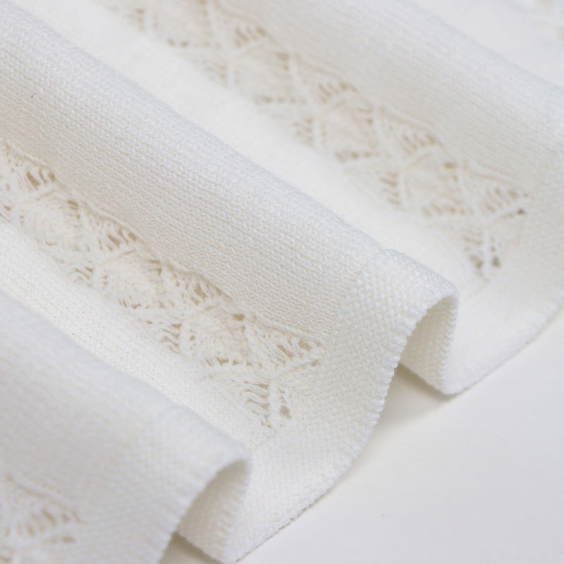 Elegant set of white lace blouse with round neckline, sleeveless, and high-quality high-waisted knit skirt