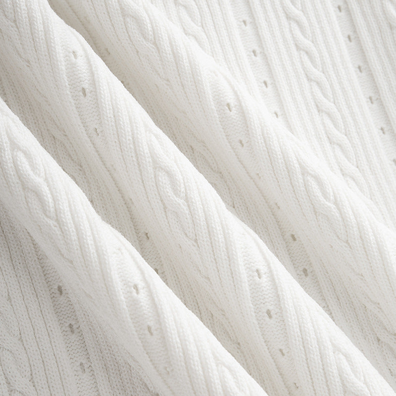 Black and white knit dress with French elegance, featuring a round neckline and high-quality short sleeves